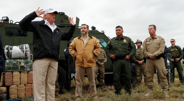 President Donald Trump speaks to reporters as he visits the banks of the Rio Grande River with Senator Ted Cruz, R-Texas, and U.S. Customs and Border Patrol officers and agents during the president's visit to the U.S. - Mexico border.