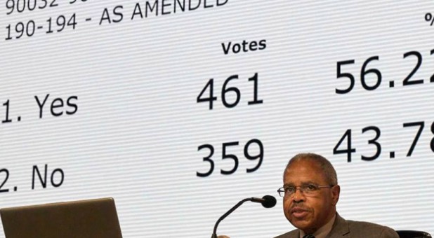 Rev. Joe Harris presides over the results of a vote about the so-called Traditional Plan/