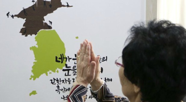 A woman prays for North Korea.