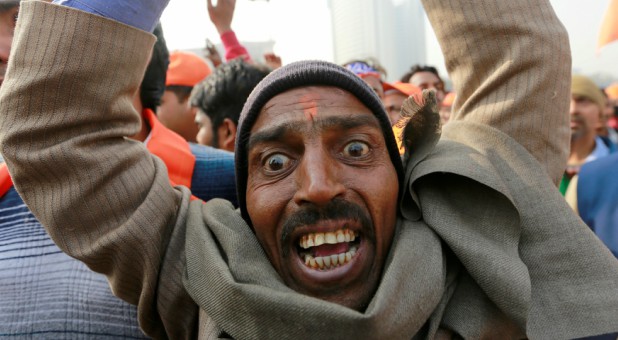 A supporter of the Vishva Hindu Parishad (VHP), a Hindu nationalist organization, shouts religious slogans during