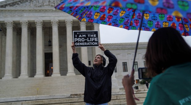 Pro-life protesters rally outside the U.S. Supreme Court .