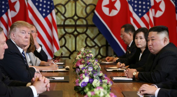 North Korea's leader Kim Jong Un and U.S. President Donald Trump look on during the extended bilateral meeting in the Metropole hotel during the second North Korea-U.S. summit in Hanoi, Vietnam.