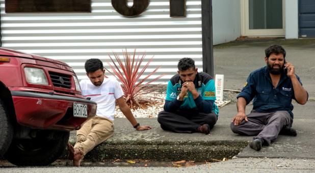 Grieving members of the public following a shooting at the Al Noor mosque in Christchurch.