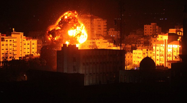 Flame and smoke are seen during an Israeli air strike in Gaza City.