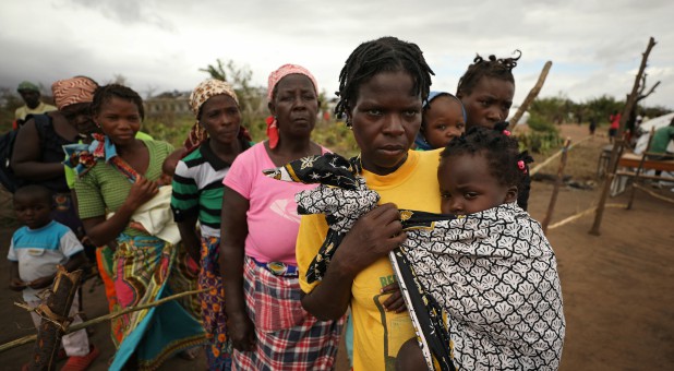 Women and children await medical treatment at a camp for people displaced in flooding in the aftermath of Cyclone Idai, near Beira, Mozambique.