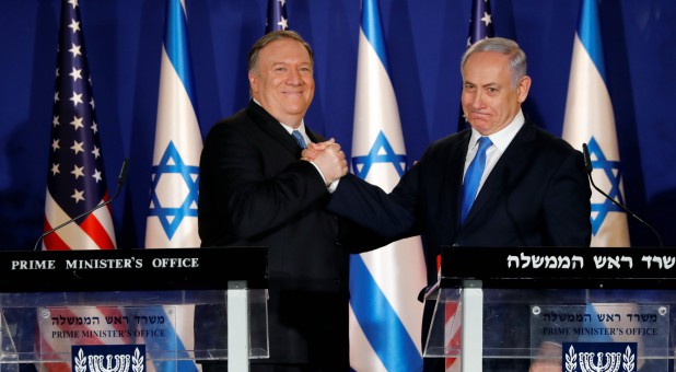 U.S. Secretary of State Mike Pompeo shakes hands with Israeli Prime Minister Benjamin Netanyahu