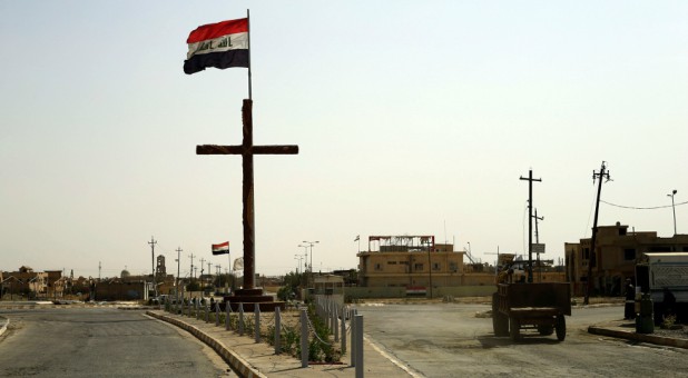 A big cross is seen at the entrance of the town of Qaraqosh, Iraq.