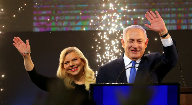 Israeli Prime Minister Benjamin Netanyahu and his wife, Sara, celebrate a possible win in Israel's elections.