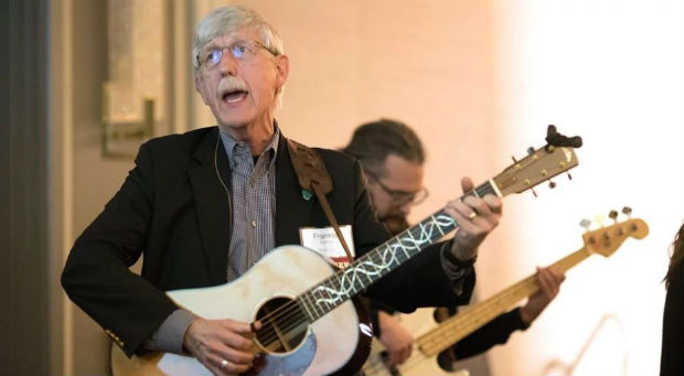 Francis Collins performs with the band during the first day of the BioLogos conference on March 27, 2019, in Baltimore, Maryland.