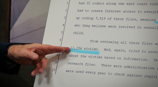 Attorney Jeff Anderson points to a legal document during a news conference accusing the Boy Scouts of America of harboring thousands of sexual abusers.