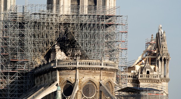 View of the rear of Notre Dame Cathedral after a massive fire devastated large parts of the Gothic structure in Paris, France.