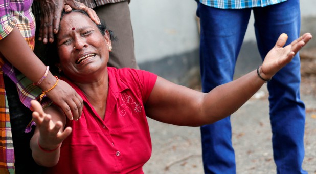 A relative of a victim of the explosion at St. Anthony's Shrine, Kochchikade church, reacts at the police mortuary in Colombo, Sri Lanka.
