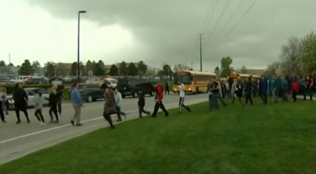 Students evacuate after a school shooting.
