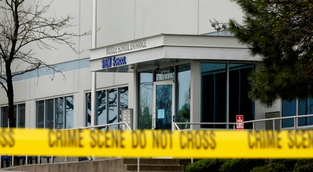 Crime scene tape is seen outside the school following the shooting at the Science, Technology, Engineering and Math (STEM) School in Highlands Ranch, Colorado.
