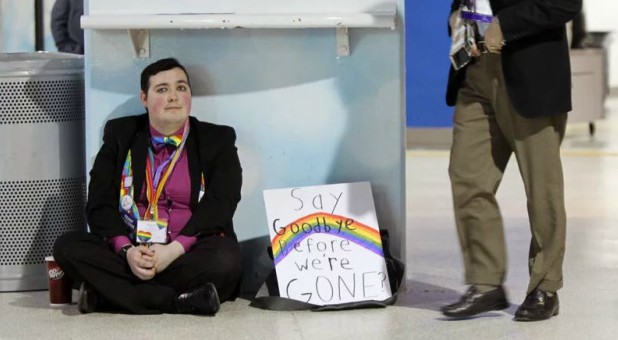 Alexander Dungan, of Garrett-Evangelical Theological Seminary near Chicago, sits near an exit of the America’s Center after a vote to adopt the Traditional Plan at the UMC General Conference in St. Louis.