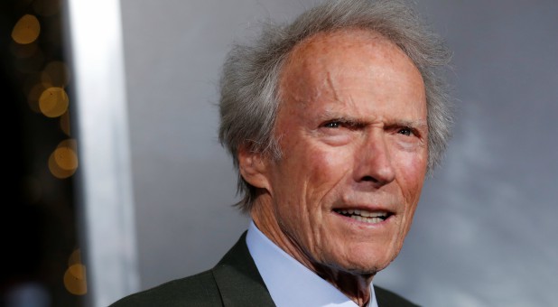 Clint Eastwood poses at the premiere of