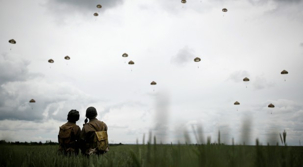 Paratroopers jump during a commemorative parachute jump over Sannerville in Normandy as France prepares to commemorate the 75th anniversary of the D-Day, France.