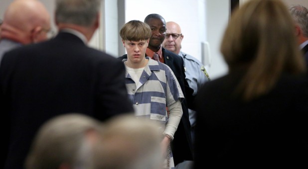 Dylann Roof is escorted into the courtroom at the Charleston County Judicial Center to enter his guilty plea on murder charges in state court for the 2015 shooting massacre at a historic black church, in Charleston, South Carolina.
