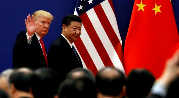 U.S. President Donald Trump and China's President Xi Jinping meet business leaders at the Great Hall of the People in Beijing.