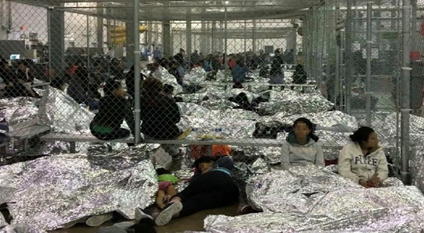 An overcrowded fenced area holding families at a Border Patrol Centralized Processing Center is seen in a still image from video in McAllen, Texas, U.S., on June 11, 2019. and released as part of a report by the Department of Homeland Security's Office of Inspector General.