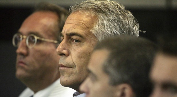 U.S. financier Jeffrey Epstein (C) appears in court where he pleaded guilty to two prostitution charges.