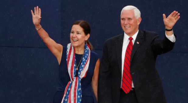 U.S. Vice President Mike Pence and and his wife, Karen, wave to the crowd.