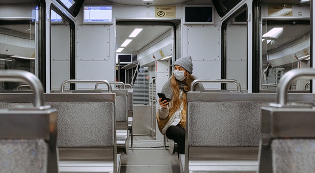 2020 04 woman wearing mask on train