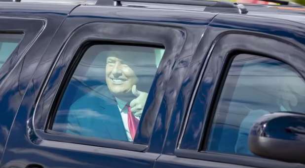 President Trump gives a thumbs-up to supporters as his motorcade heads to Mar-a-Lago in West Palm Beach, Florida, Jan. 20, 2021.