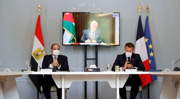 French President Emanuel Macron and Egyptian President Abdel Fattah al-Sisi attend video conference with Jordan's King Abdullah II ibn Al Hussein (on screen)