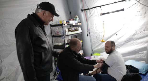 Franklin Graham (L) visits a Samaritan's Purse field hospital on a recent visit to Ukraine.