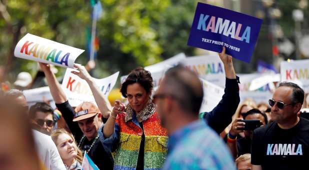 Democratic presidential candidate Kamala Harris gestures as she joins supporters of the LGBTQ community at the Pride Parade in San Francisco, California, U.S., June 30, 2019.