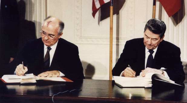File photo of U.S. President Ronald Reagan (R) and Soviet President Mikhail Gorbachev signing the Intermediate-Range Nuclear Forces (INF) treaty at the White House, Washington on Dec, 8, 1987.