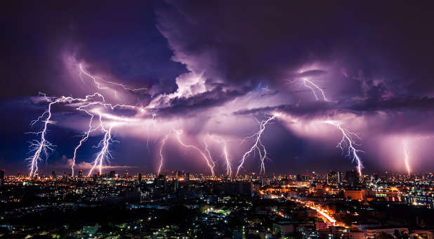 Purple lightning above a city.