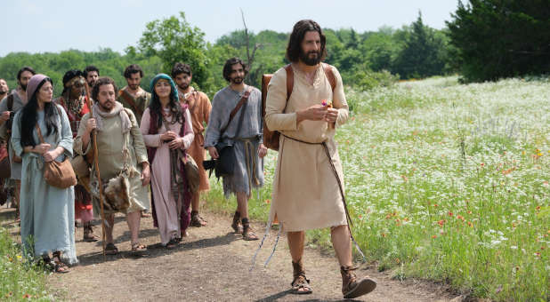 Jesus walking with His disciples.