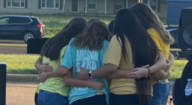 Girls praying on See You at the Pole Day