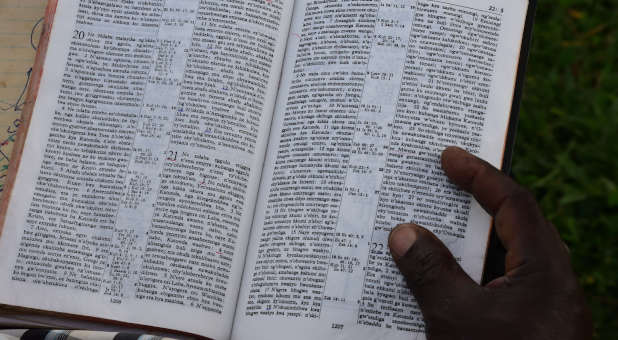 Ugandan Christian reading Bible