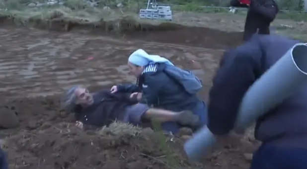 A nun tackled a protester outside the construction of a new religious center in France.