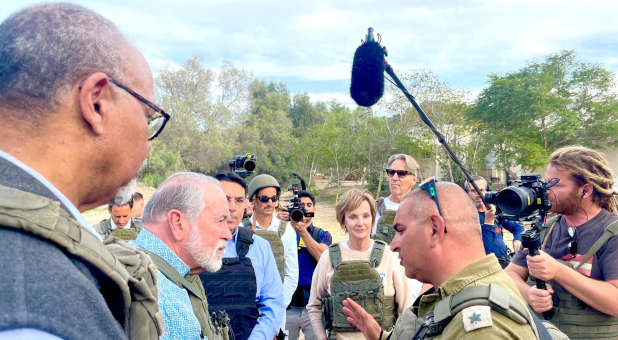 Evangelical leaders touring the ruins of Kfar Aza.