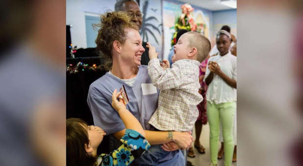 Inmate reunited with her children.