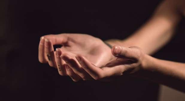 Hands stretched out in offering