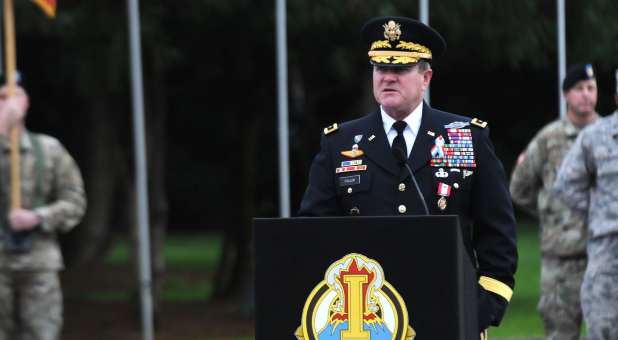 General Kurt Fuller in military dress uniform, behind podium