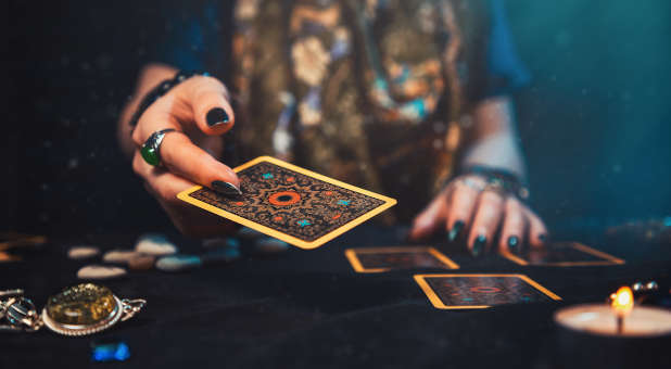 Psychic using tarot cards.