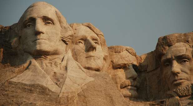 Faces of George Washington, Thomas Jefferson, Theodore Roosevelt and Abraham Lincoln carved into Mount Rushmore, South Dakota