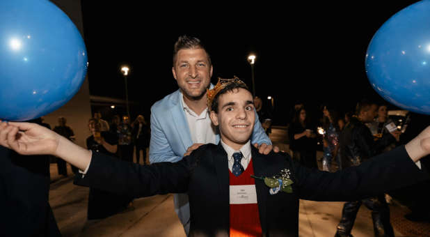 Tim Tebow and guest of honor at Night to Shine event.
