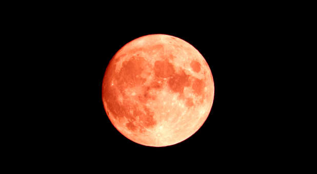 A super moon giving off a red glow.