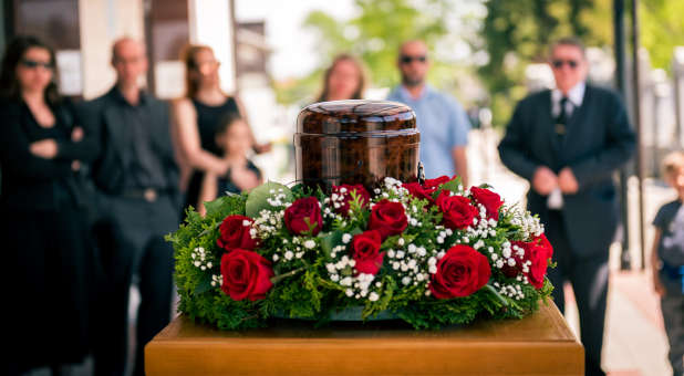 An urn containing cremated remains at a memorial service.