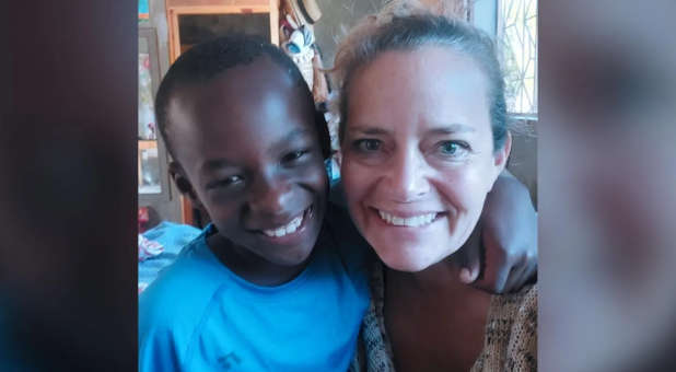 Missionary in Haiti with Haitian child.