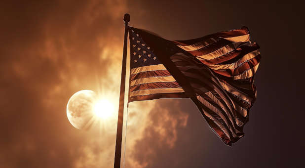 American flag in front of a total eclipse.
