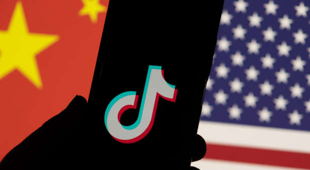 TikTok app with Chinese and American flag background.