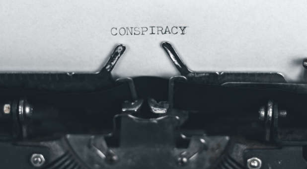 Typewriter with Conspiracy written on paper